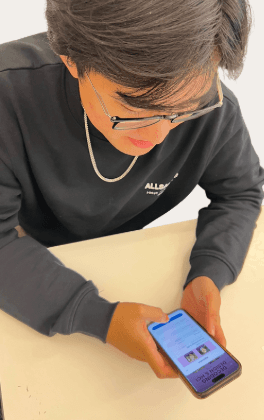 Student with phone showing the simplified sign-up confirmation